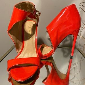 Pair of red heels by Lilana